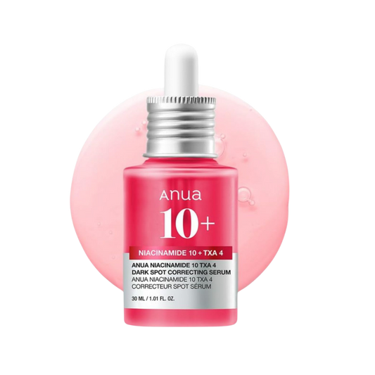 Anua 10+ Dark Spot Correcting Serum in a pink dropper bottle with a silver cap, set against a pink circular gel background on a white studio backdrop. Nicosia, Cyprus