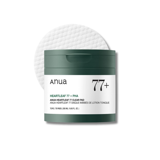 Anua 77+ Heartleaf 77 Clear Pad jar with a dark green lid and white label, shown with a white cotton pad behind it on a light gray background. nicosia, cyprus